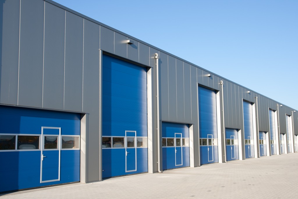 Silver industrial unit with roller shutter doors